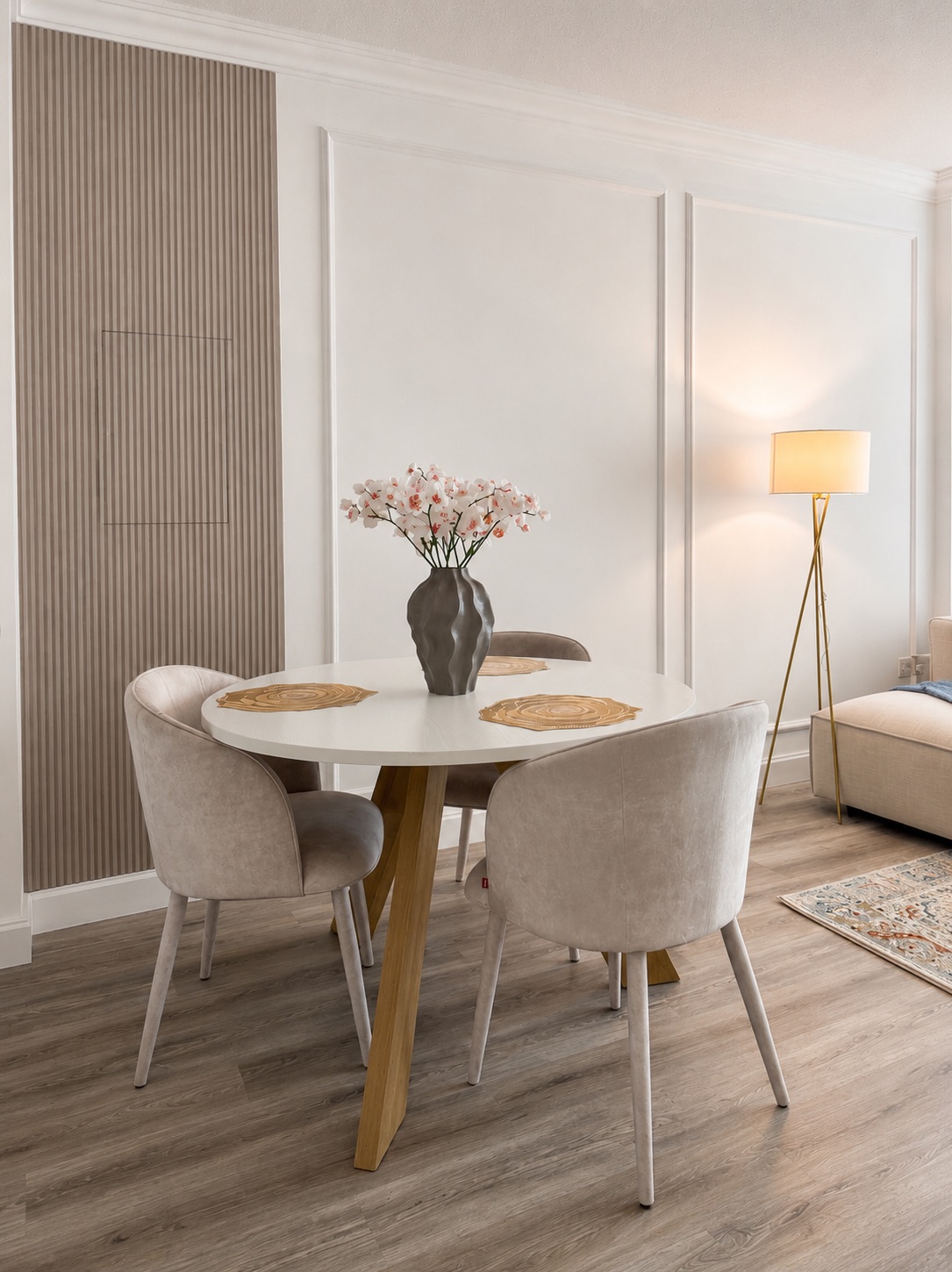 Four-seat dining area with warm neutral finishes